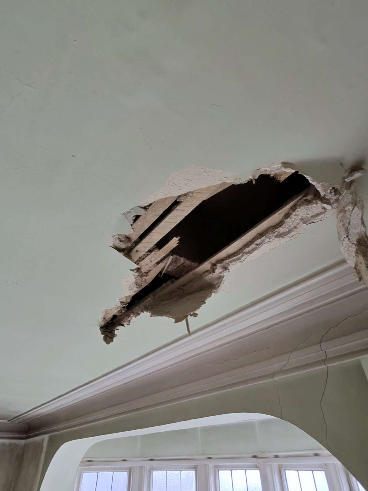 Ceiling breached – original void and lath exposed