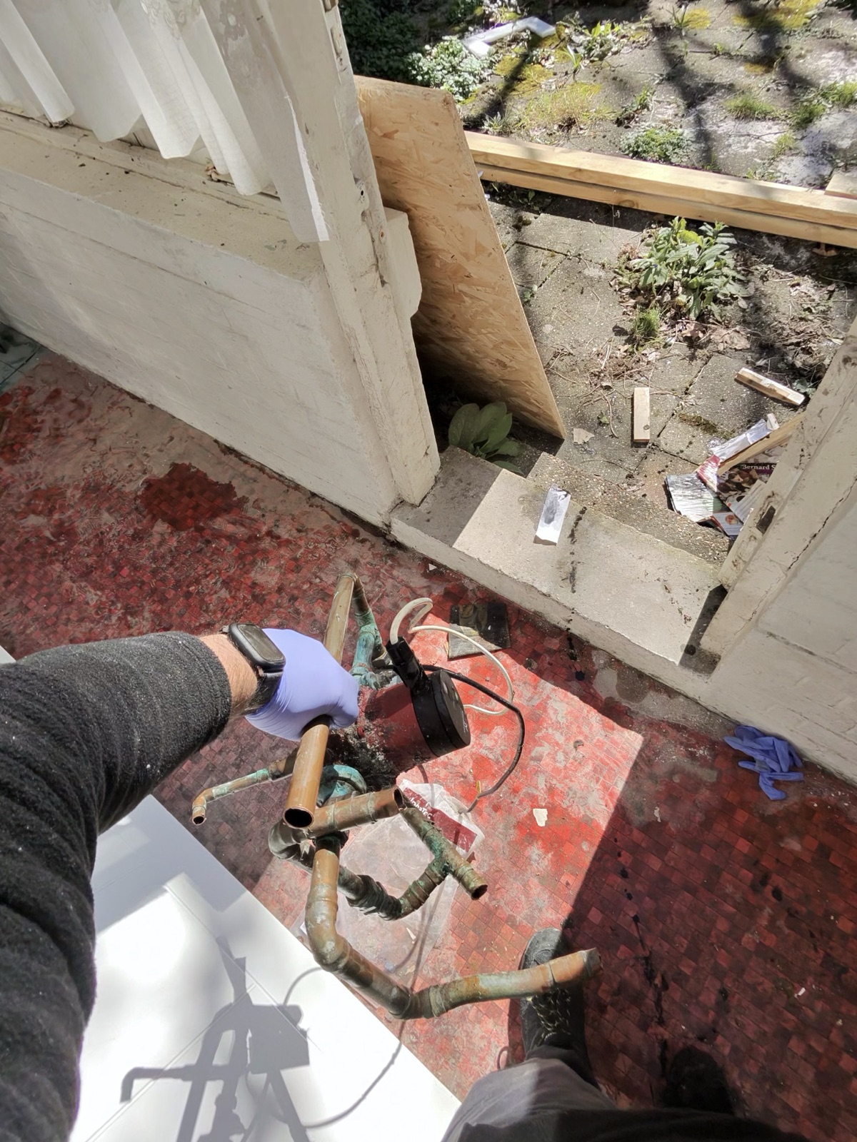 Old plumbing system removal – exposed pipework